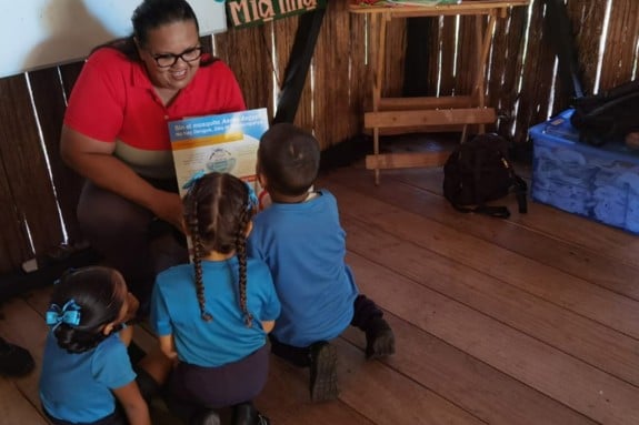 Elizabeth Gomez Bran is taking care of children.