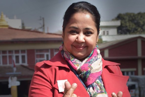Puja Koirala smiling at the camera