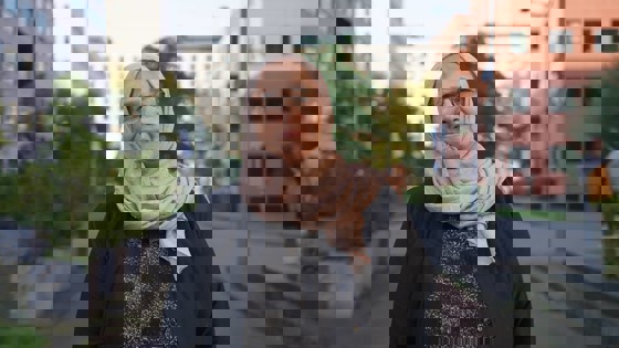 Aida Elsayed is smiling and looking straight at the camera.