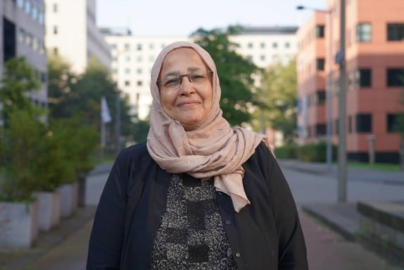 Aida Elsayed is smiling and looking at the camera.