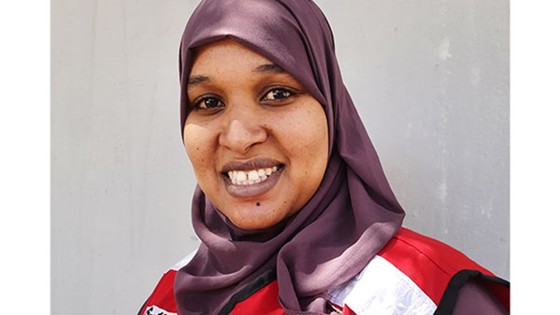 Aziza Abdikadir Hassan smiling at the camera