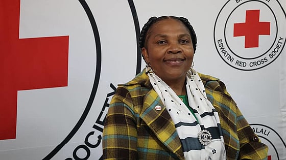 Happy Nozizwe Dlamini is smiling in to the camera.