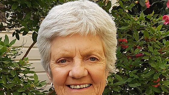 Willi Cabot is smiling and looking at the camera.