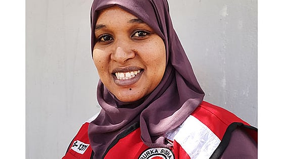 Aziza Abdikadir Hassan smiling at the camera