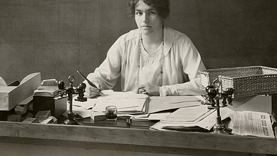 Archive picture of Marguerite Frick-Cramer sitting at a desk