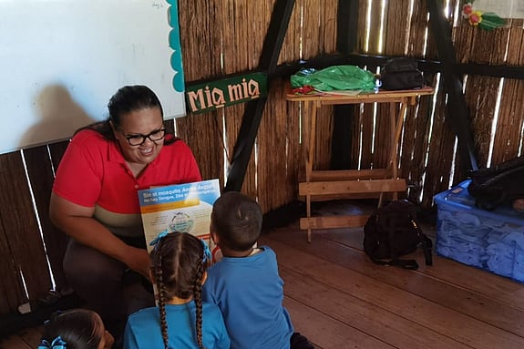 Elizabeth Gomez Bran is taking care of children.