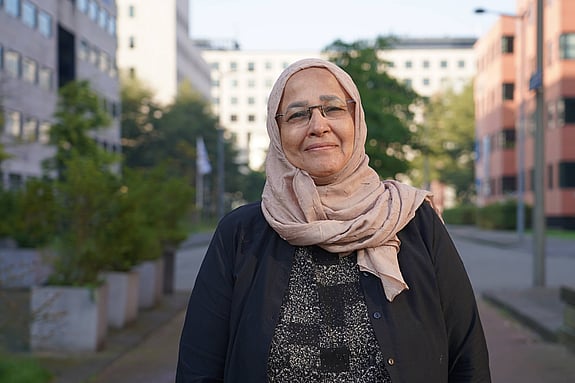 Aida Elsayed is smiling and looking at the camera.