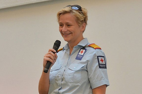 Kjersti Løvik speaking with a microphone