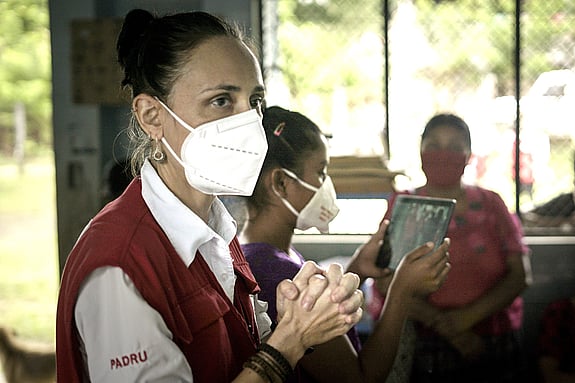 Diana Medina, IFRC, in a white face mask