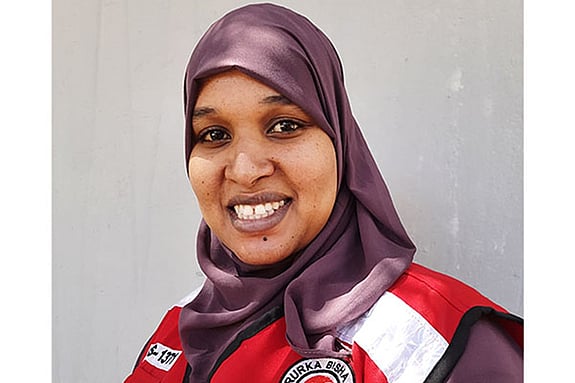 Aziza Abdikadir Hassan smiling at the camera