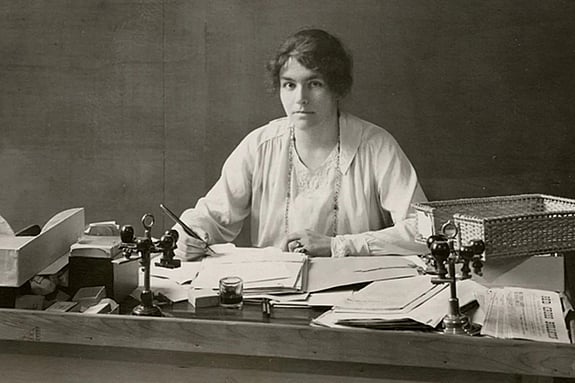 Archive picture of Marguerite Frick-Cramer sitting at a desk