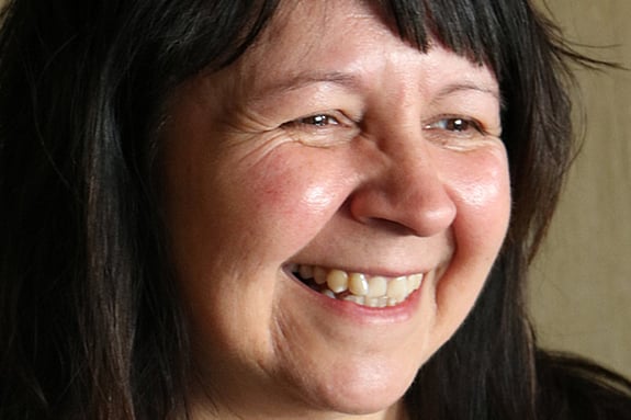 Shelley smiling looking towards something off-camera