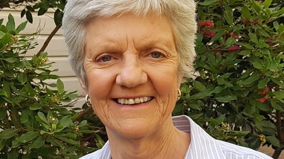 Willi Cabot is smiling and looking at the camera.